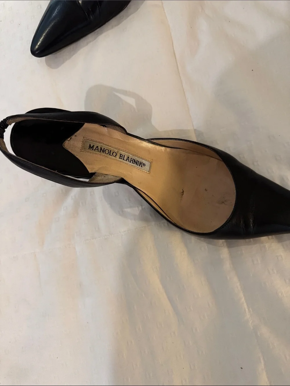 Manolo Blahnik “Carolyne” Black Pointed-Toe Slingback Heels